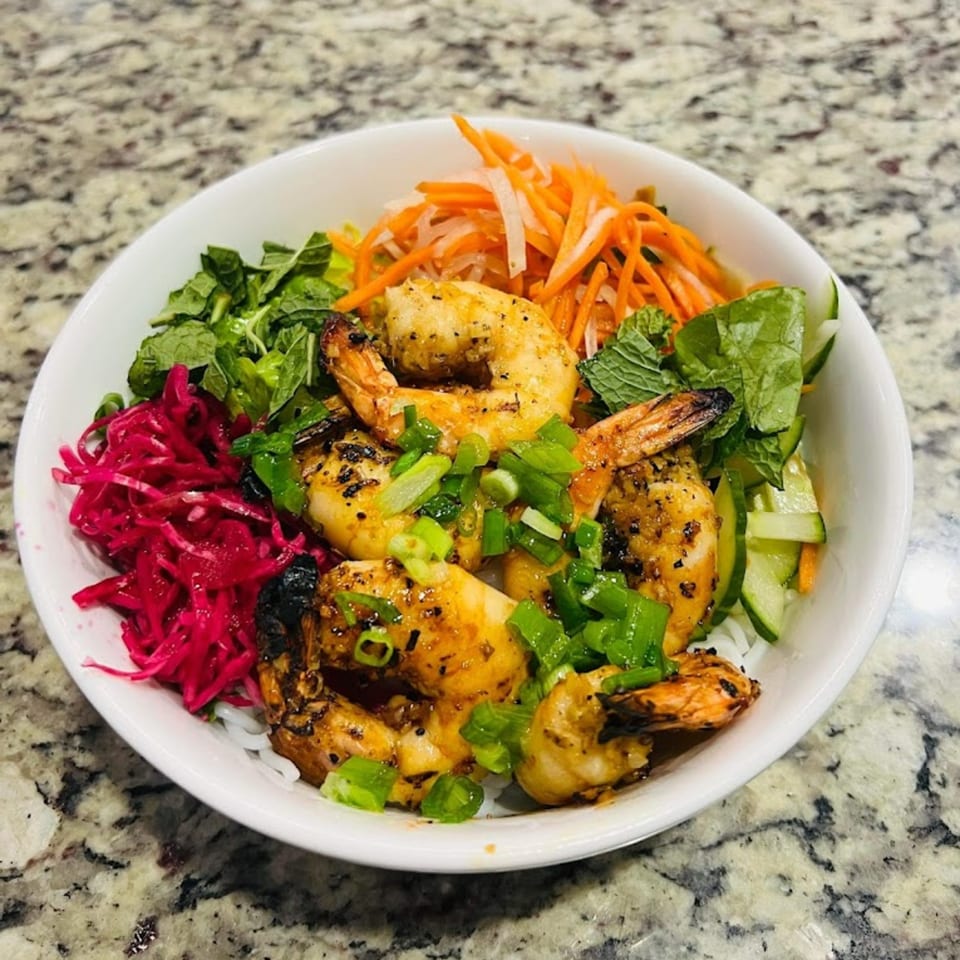 Cafe LaVie's grilled shrimp vermicelli bowl with pickled vegetables, mint, and scallions.