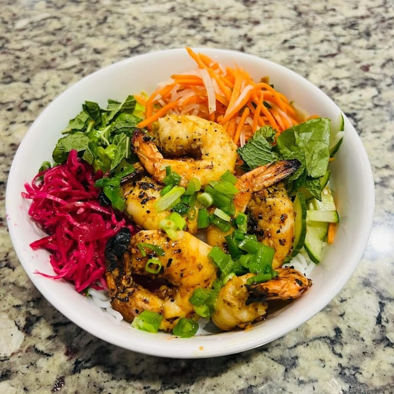 Cafe LaVie's grilled shrimp vermicelli bowl with pickled vegetables, mint, and scallions.